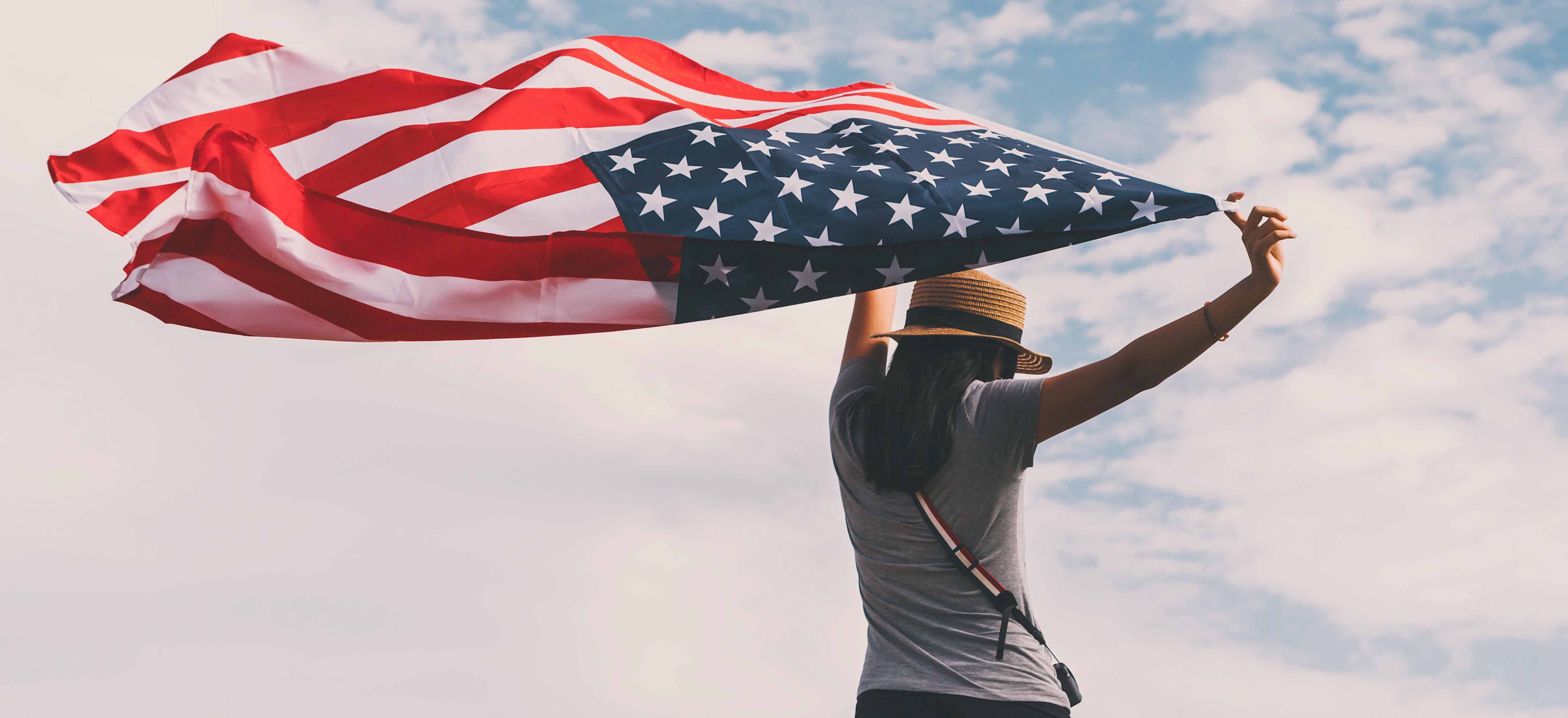 YoungWomanHoldingAmericanFlagcropped Texas Catholic Conference