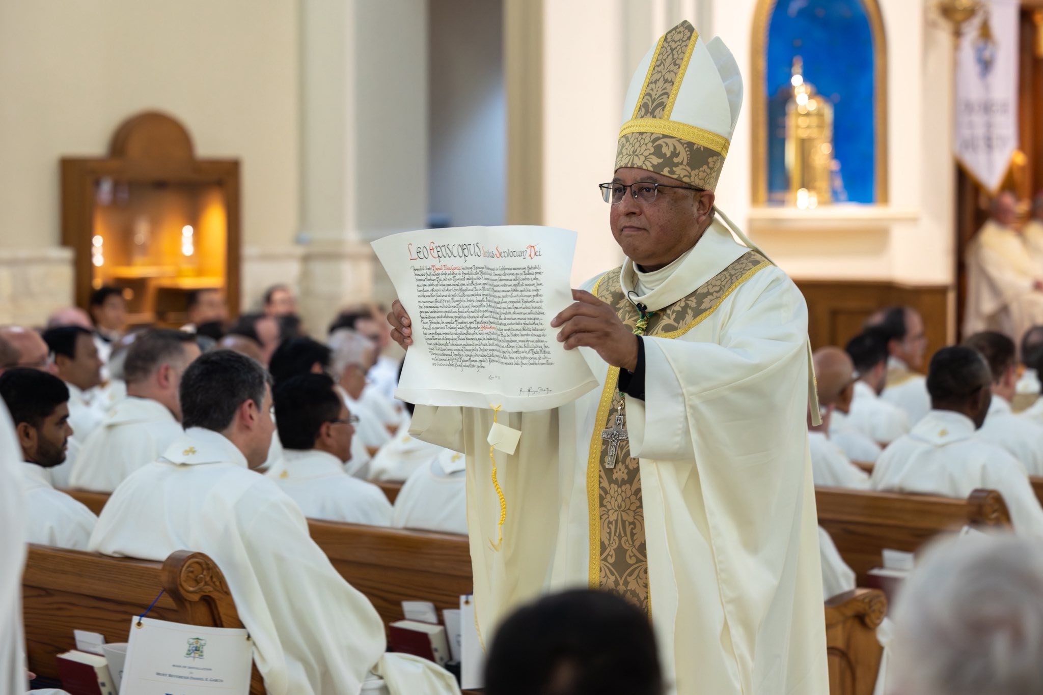 On Sept. 18, Bishop Daniel Garcia was installed as bishop of Austin. One aspect of the rite is for him to show the papal bull, or appointment, to the faithful, asking for their affirmation of his service. (Photo courtesy Diocese of Austin)